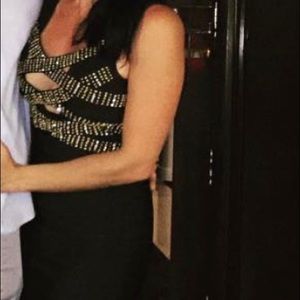 Bandage black dress with gold and diamond details.